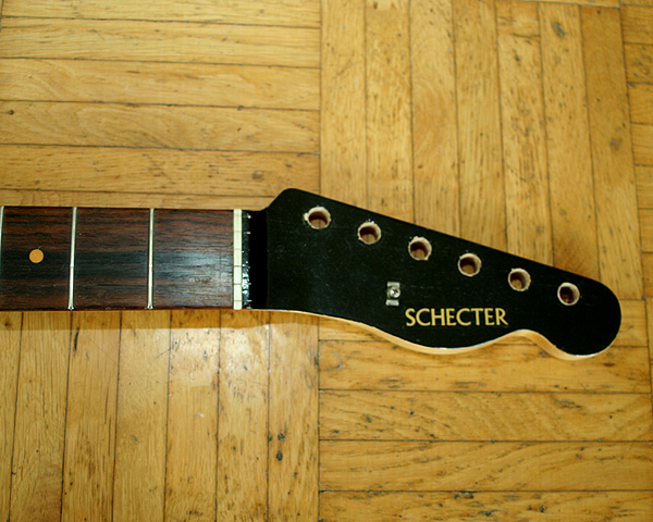 The Schecter neck has a painted peghead - like Mark's Walk of Life Tele which is in red. Not sure what to do with this one but I guess I will keep it like this to preserve the decal and originality.